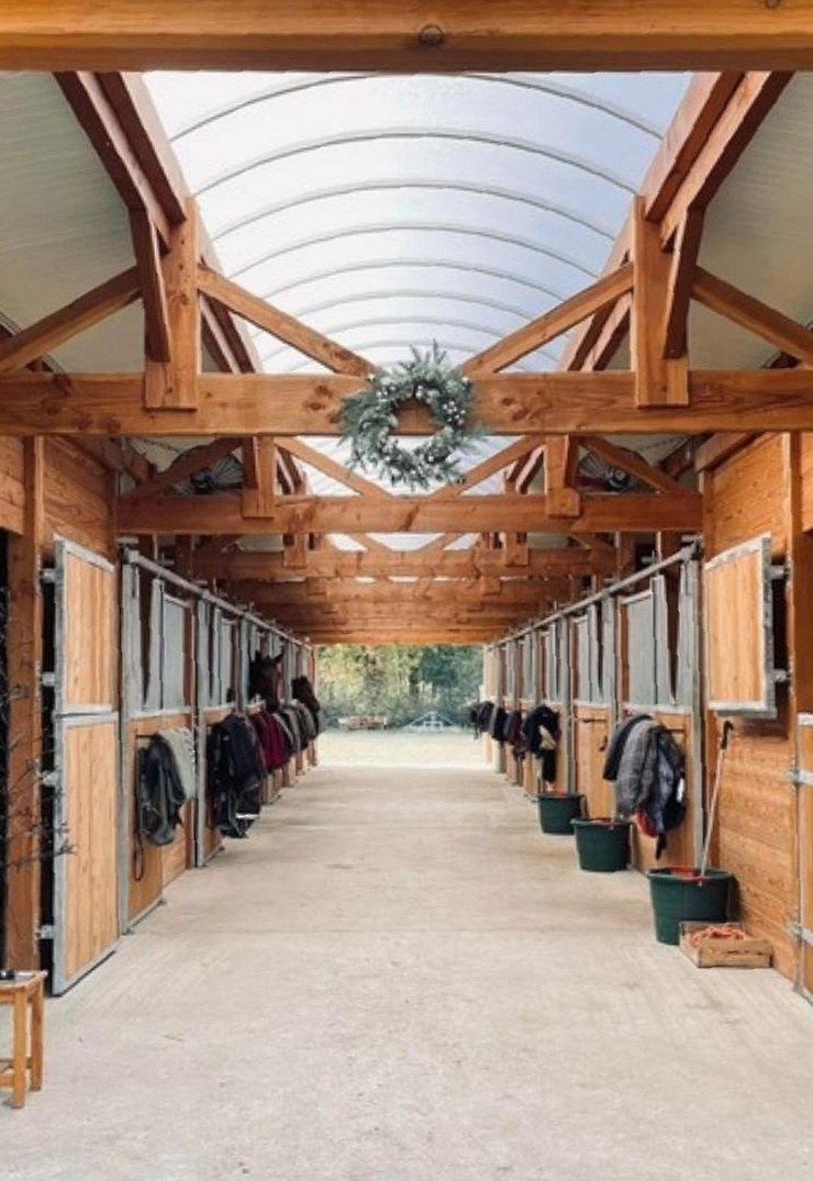 Timber barn interior at Ecurie du Grand Roudie